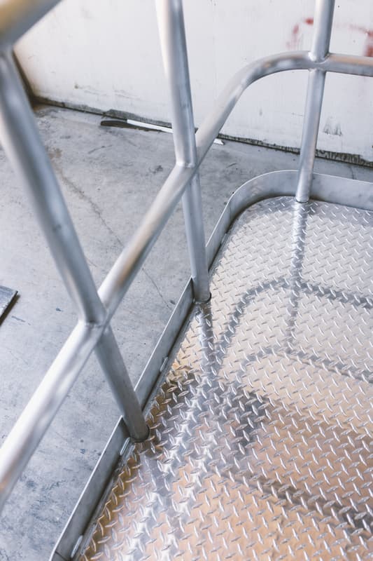 Bent tube guard rail and platform assembly