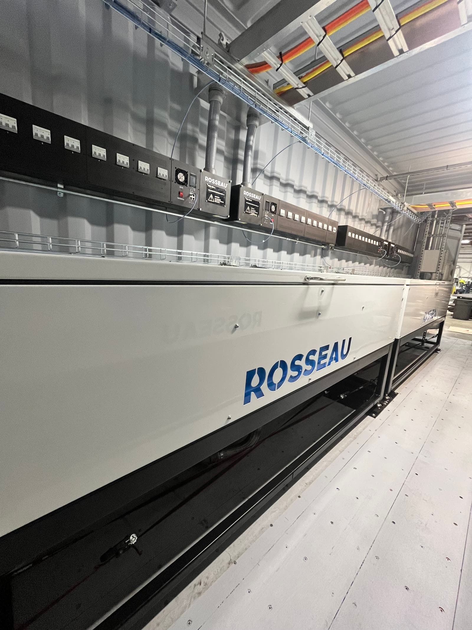 Side view of Rosseau immersion-cooled container in shop